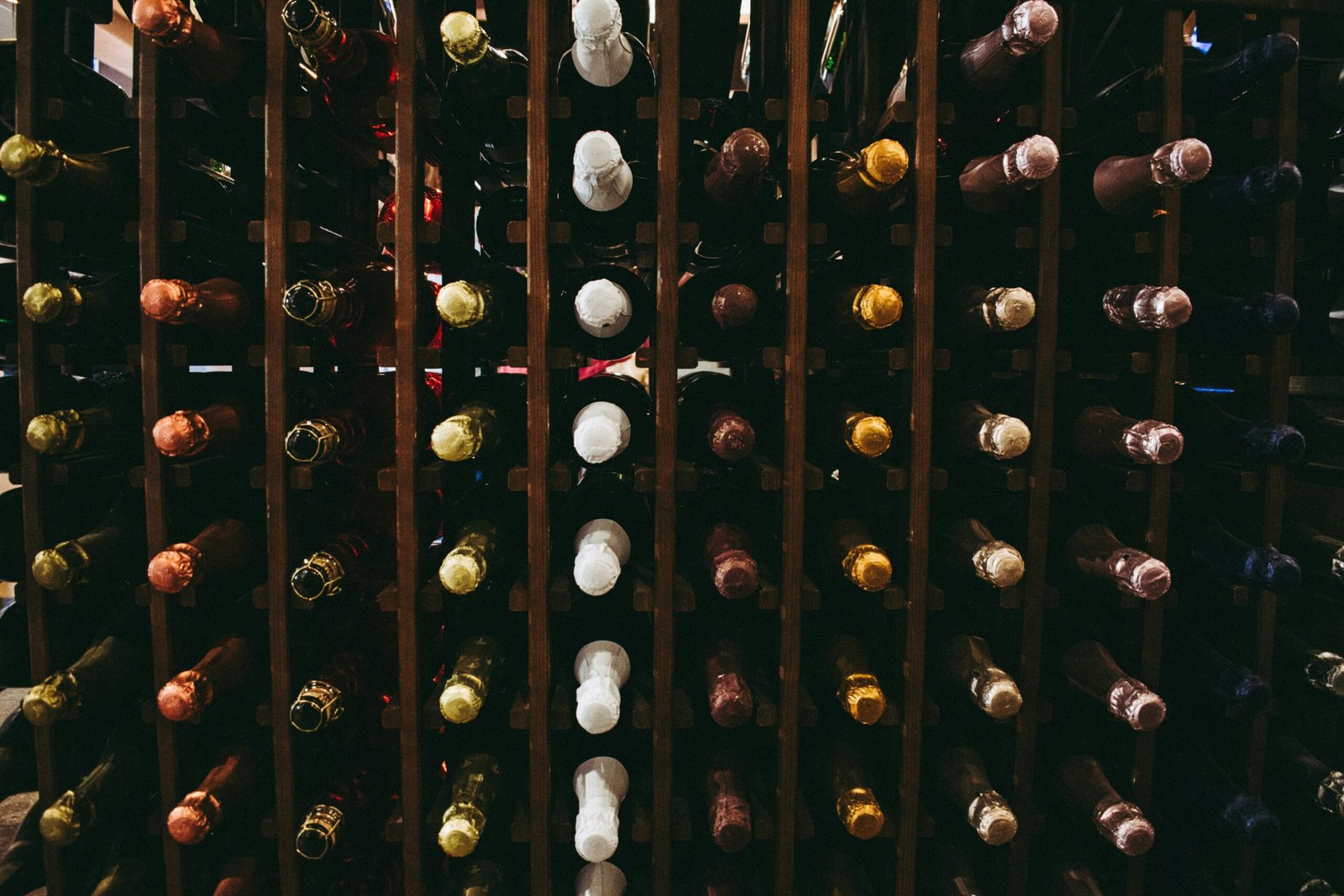 assorted wine bottle on racks